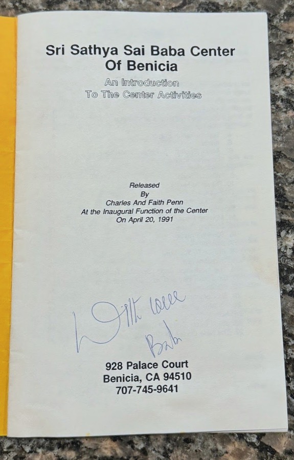 The center's inaugural booklet from April 20, 1991, signed With Love, Baba by Sri Sathya Sai Baba